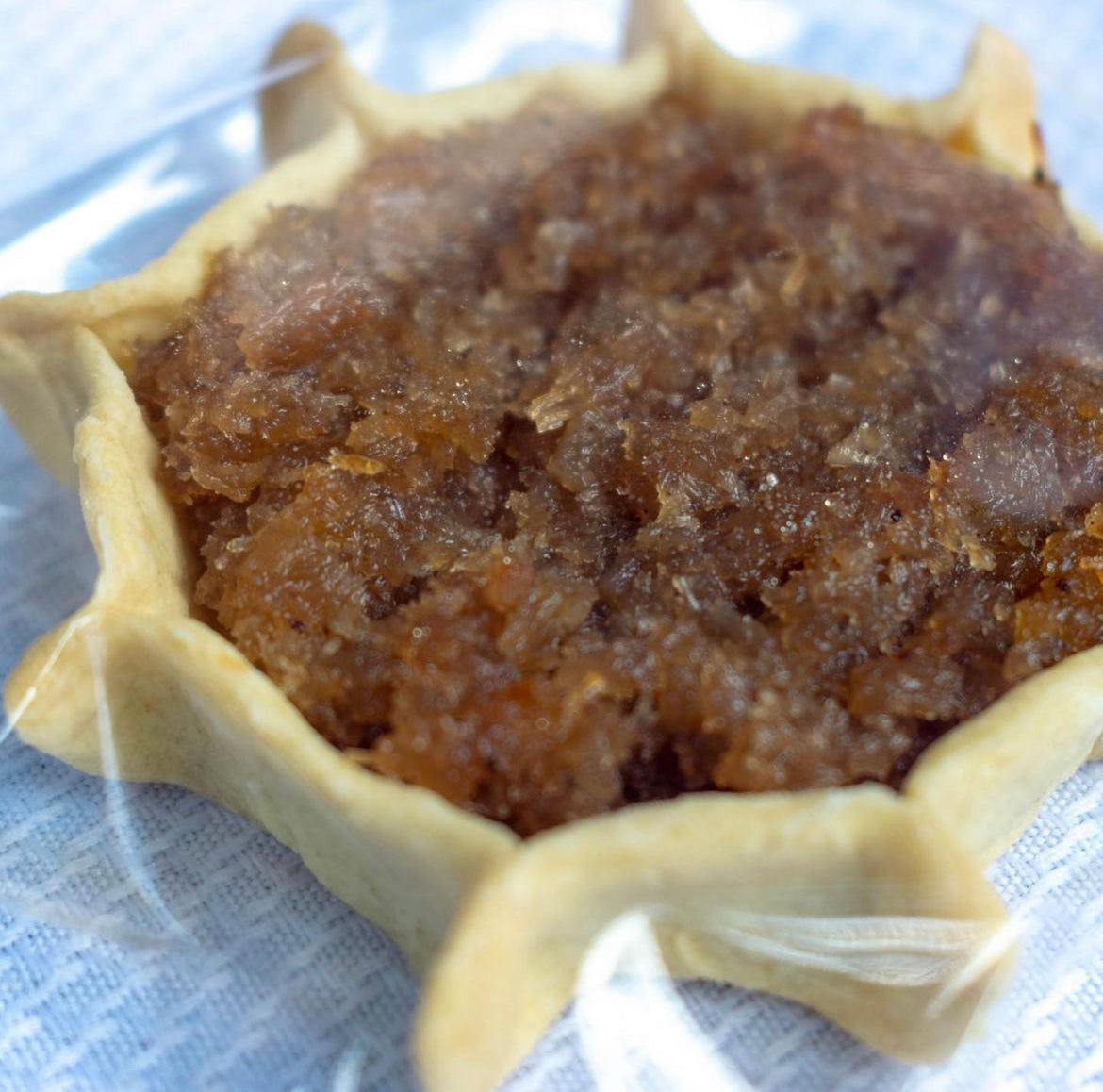 Authentic Jamaican gizzada pastry filled with sweet spiced coconut, freshly baked and packaged for sale.
Conyers GA and Atlanta