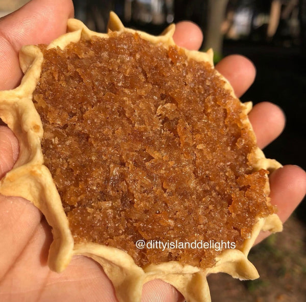 Authentic Jamaican gizzada pastry filled with sweet spiced coconut, freshly baked and packaged for sale. 
Conyers GA and Atlanta