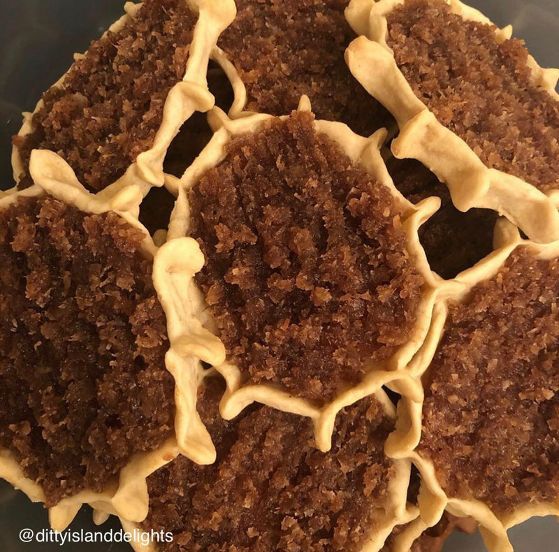 Authentic Jamaican gizzada pastry filled with sweet spiced coconut, freshly baked and packaged for sale. Conyers & Atlanta GA.
