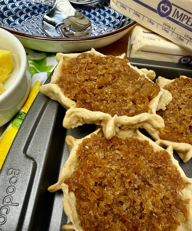 Authentic Jamaican gizzada pastry filled with sweet spiced coconut, freshly baked and packaged for sale. Conyers & Atlanta GA.